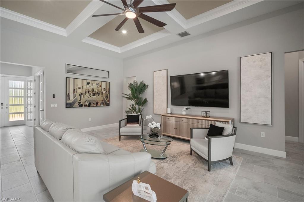 14227 Wild Timber Court Estero, FL 33928 - Photo 27 of 49 a living room with furniture and a flat screen tv