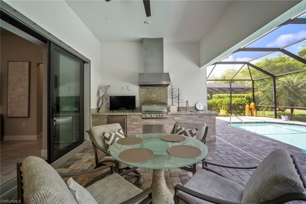 14227 Wild Timber Court Estero, FL 33928 - Photo 36 of 49 a view of a dining room with furniture window and outside view