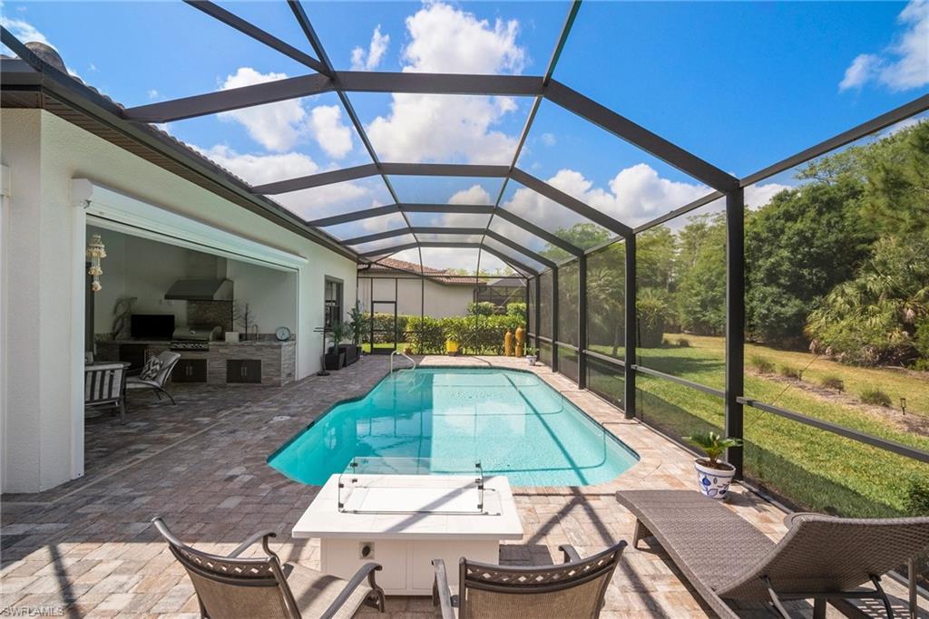 14227 Wild Timber Court Estero, FL 33928 - Photo 38 of 49 a view of a swimming pool with a patio