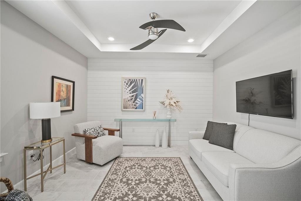 14227 Wild Timber Court Estero, FL 33928 - Photo 4 of 49 a living room with furniture and a flat screen tv