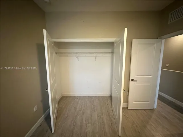 a view of small space with wooden floor