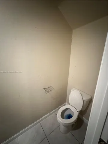 a bathroom with a toilet and a sink