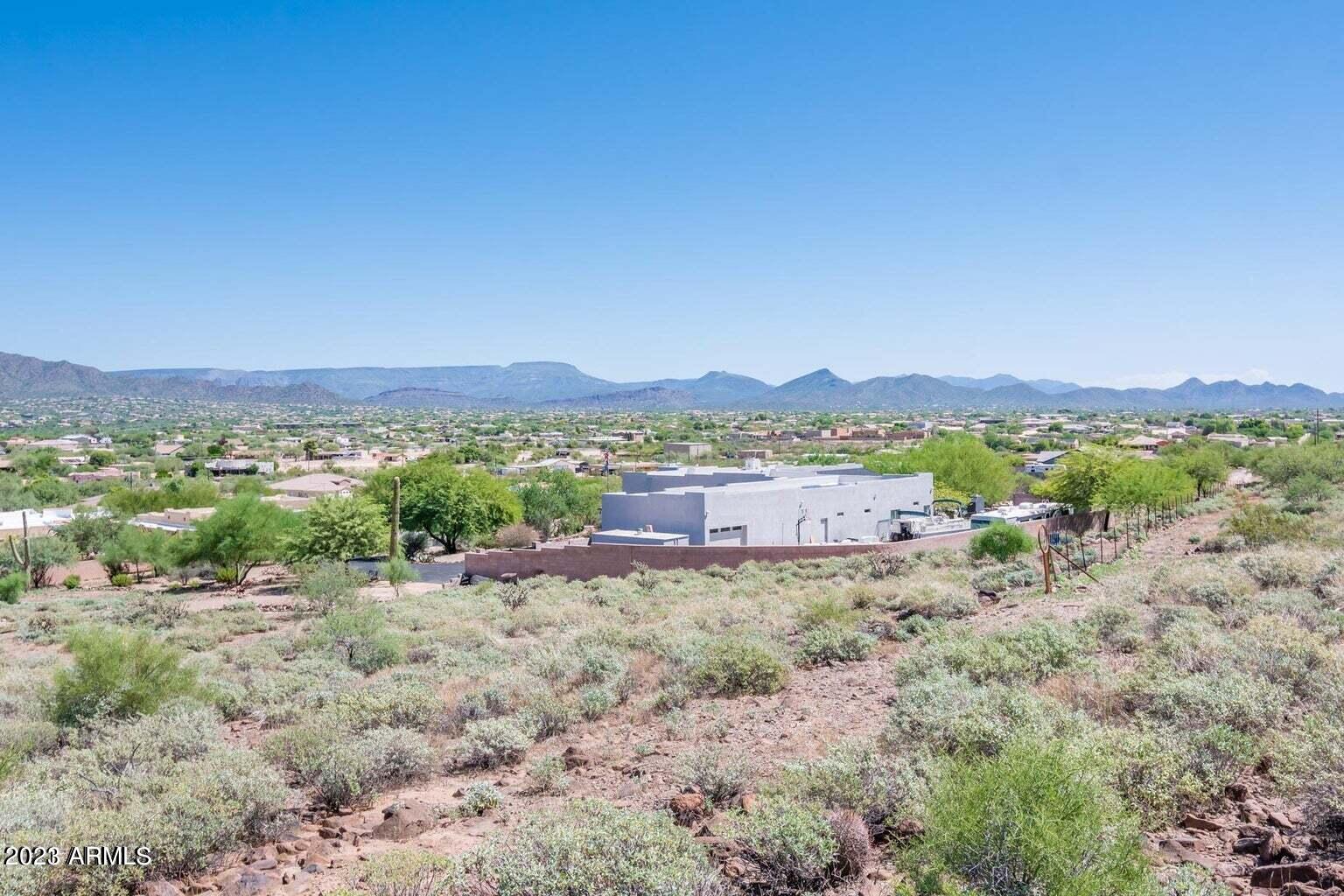 0 West Irvine Road Phoenix, AZ 85086 - Photo 11 of 13 a view of a lush green field with mountains in the background