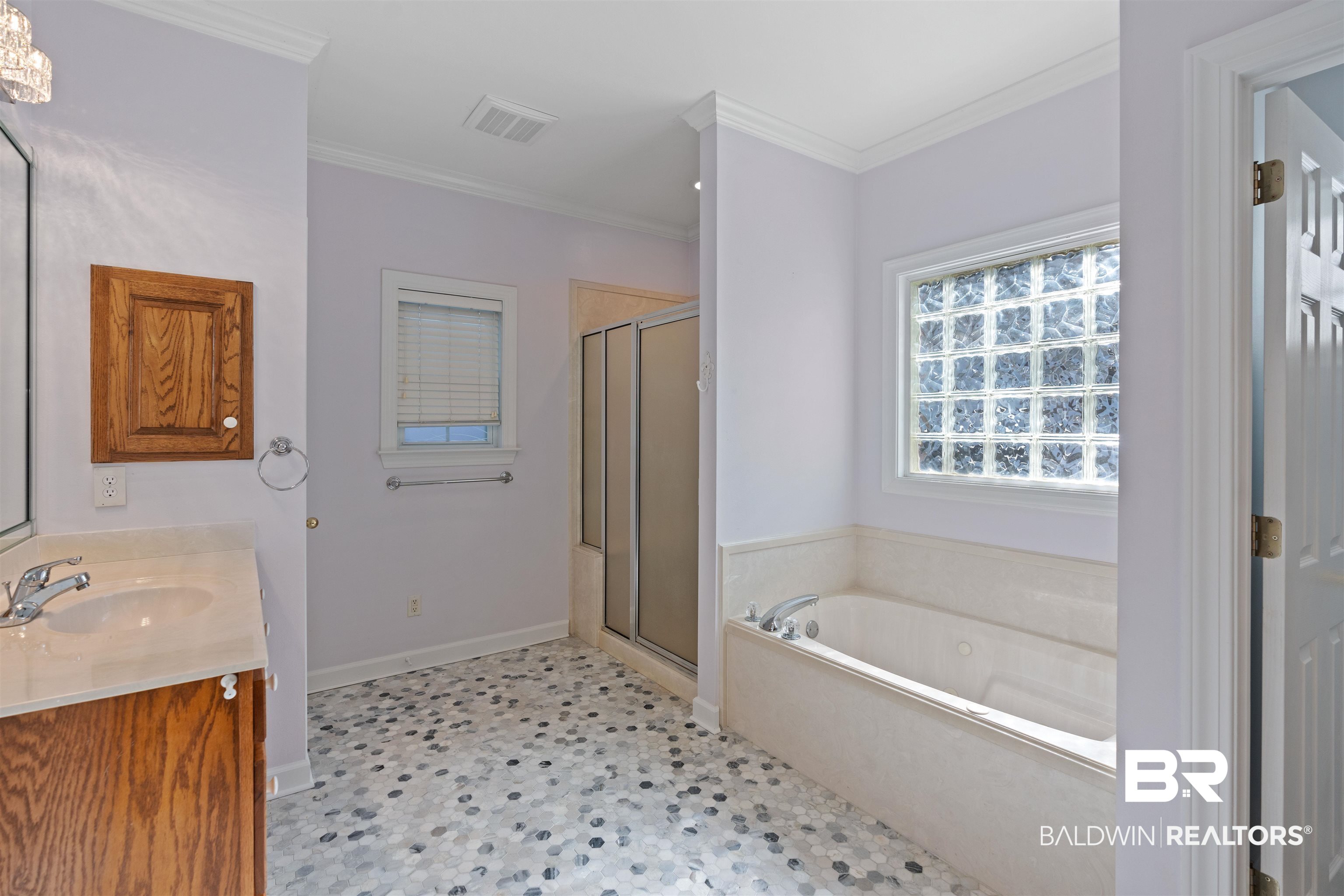 4 Judd Trail Daphne, AL 36527 - Photo 28 of 45 Bathroom with a bath, visible vents, a shower stall, and crown molding