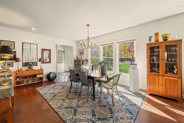 a view of a dining room with furniture window and wooden floor