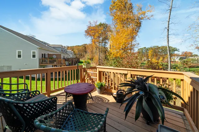 a view of a balcony with chairs