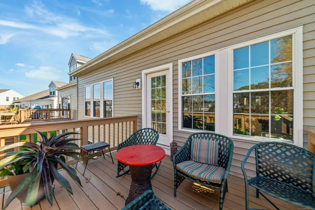 a balcony with furniture and a potted plant
