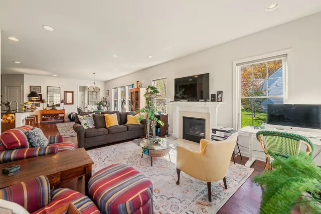a living room with furniture fireplace and a flat screen tv