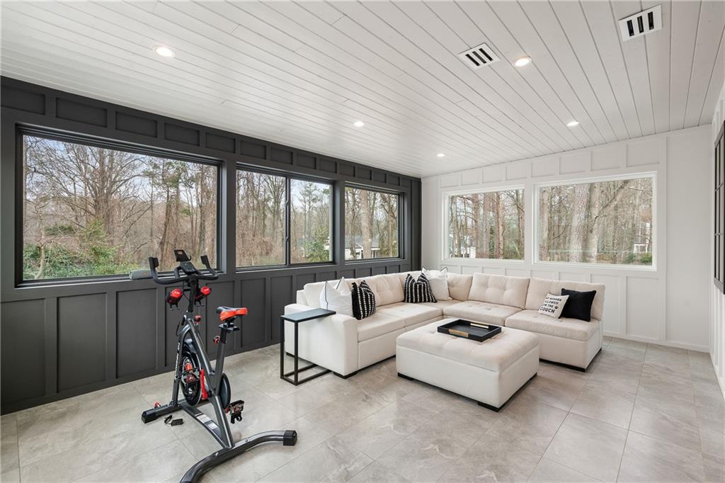 185 Pebble Trail Alpharetta, GA 30009 - Photo 39 of 55 a living room with furniture gym equipment and a large window