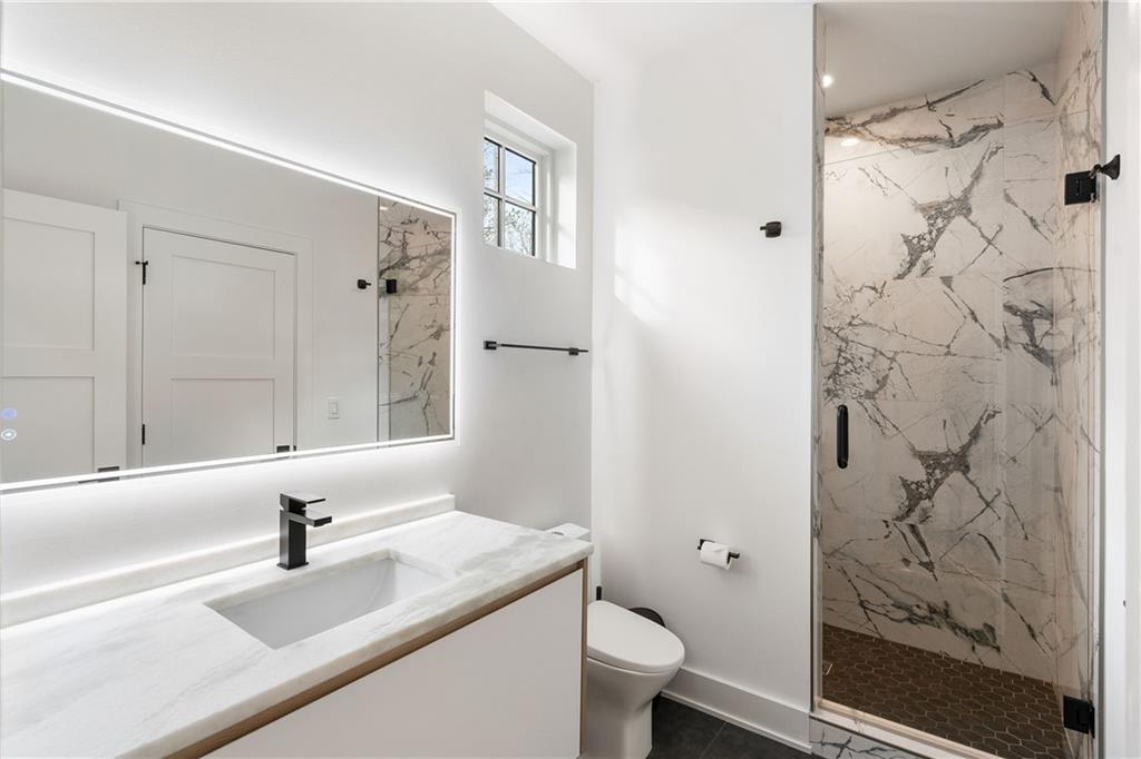 185 Pebble Trail Alpharetta, GA 30009 - Photo 42 of 55 a bathroom with a sink toilet and shower