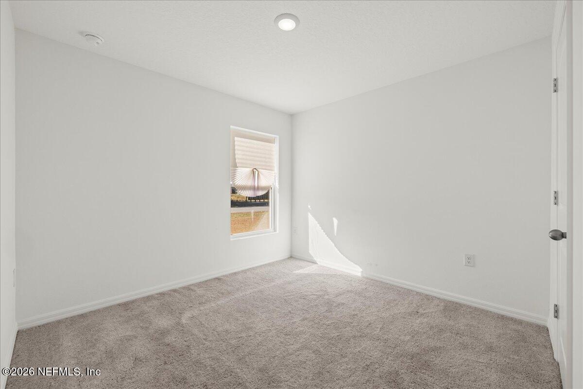 671 Live Oak Loop Crescent City, FL 32112 - Photo 13 of 38 a view of an empty room and a window