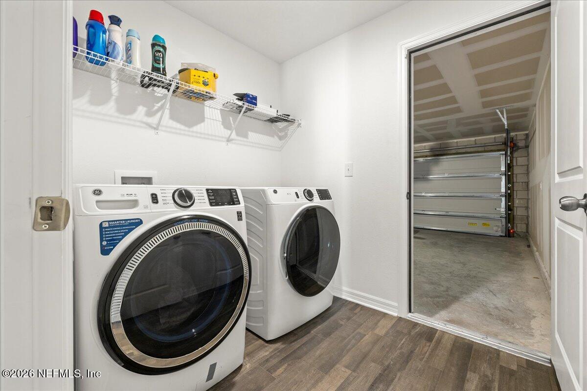 671 Live Oak Loop Crescent City, FL 32112 - Photo 27 of 38 a utility room with dryer and washer