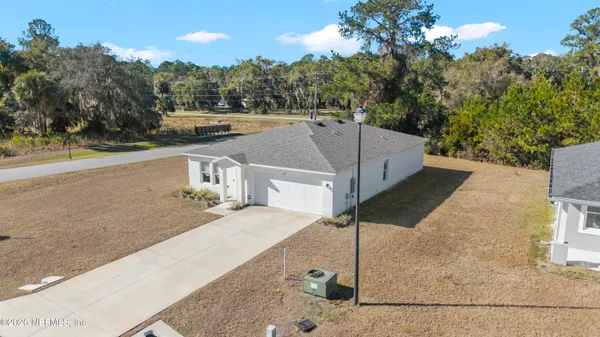 a view of a house with a park