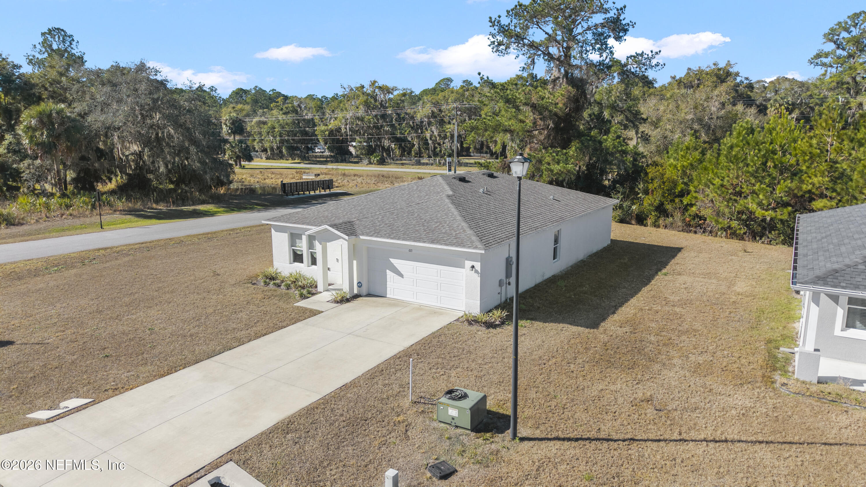 671 Live Oak Loop Crescent City, FL 32112 - Photo 5 of 38 a view of a house with a park