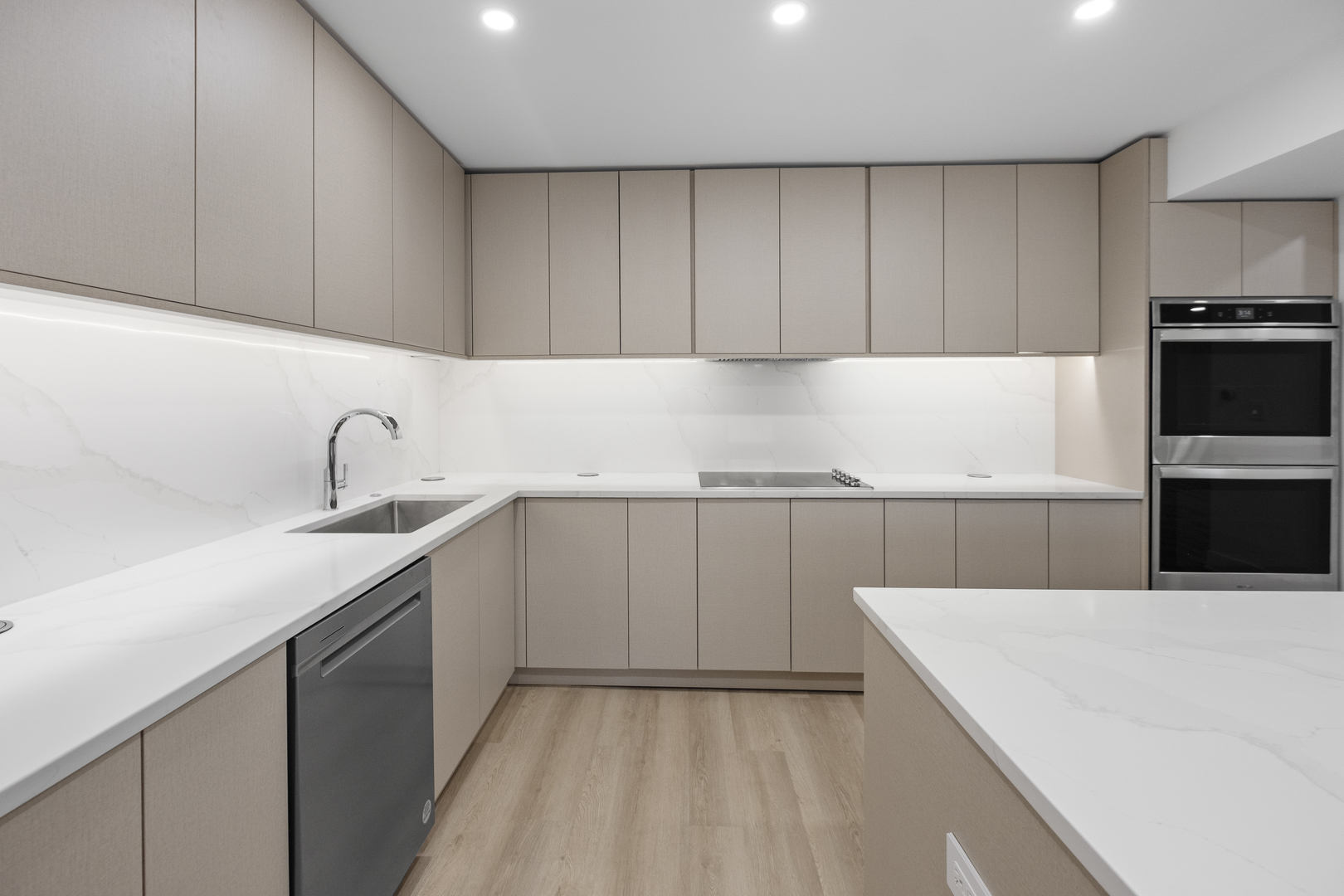 4000 Dundee Road, Unit 304 Northbrook, IL 60062 - Photo 2 of 28 a kitchen with a sink a stove and cabinets