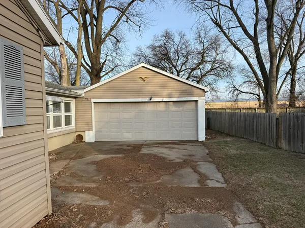a view of a house with a large tree