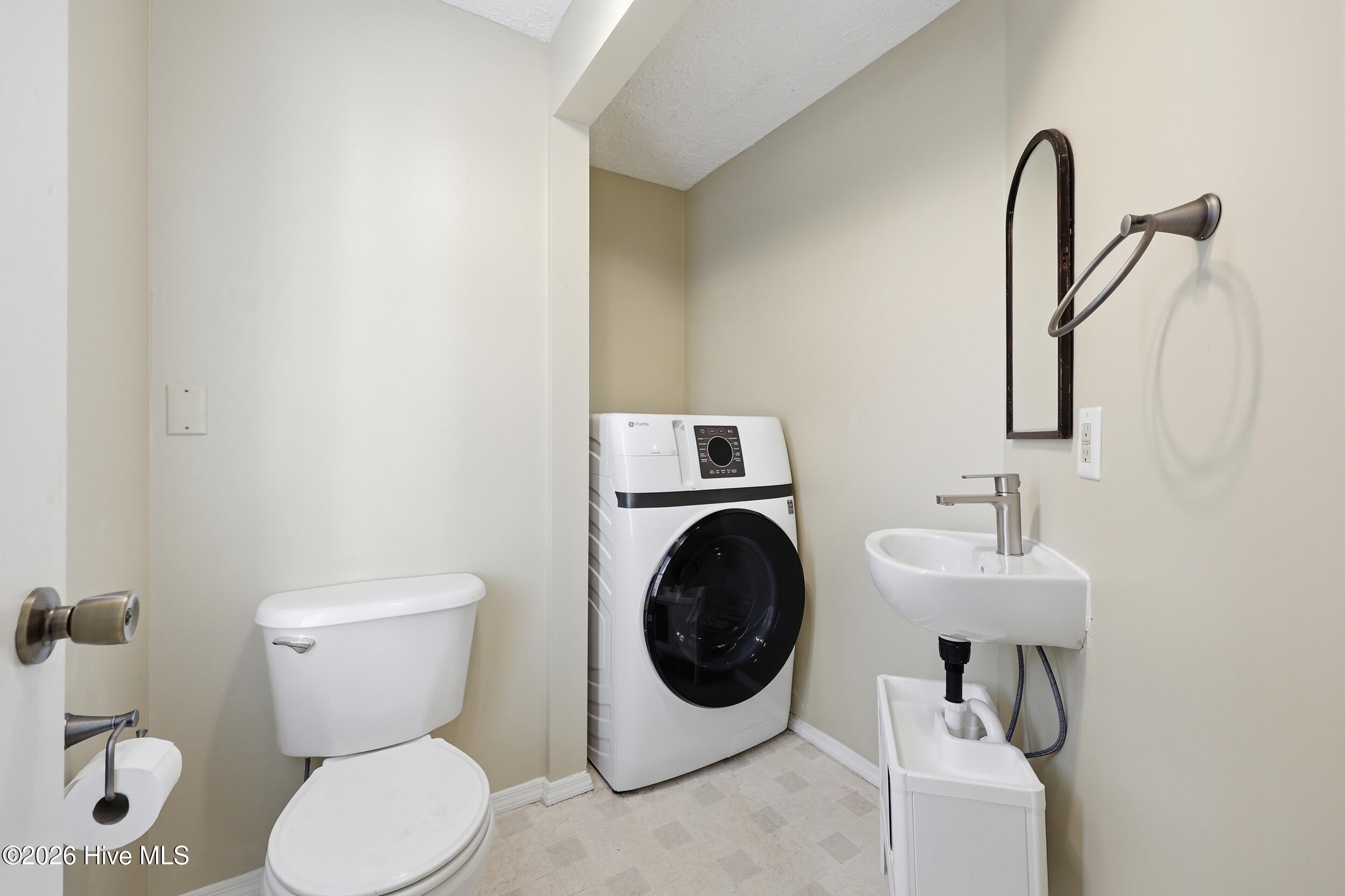 205 West Gale Street Edenton, NC 27932 - Photo 16 of 18 Great half bath with laundry area and the washer/dryer conveys!