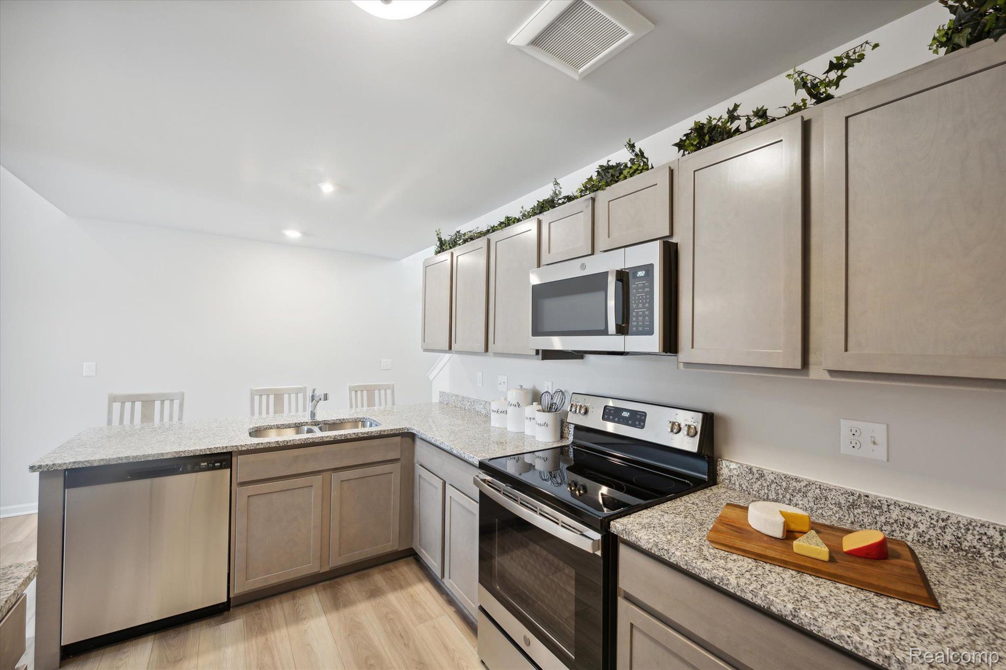 9917 Ridge Run Street, Unit 93 Howell, MI 48855 - Photo 6 of 21 Stainless Appliances
