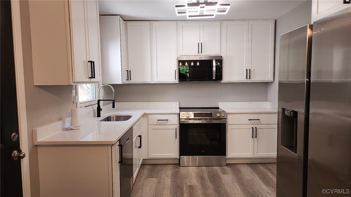 19136 River Town Road Yale, VA 23897 - Photo 1 of 1 Kitchen featuring wood finished floors, appliances