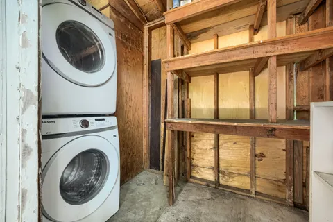 a view of a hallway with washer and dryer