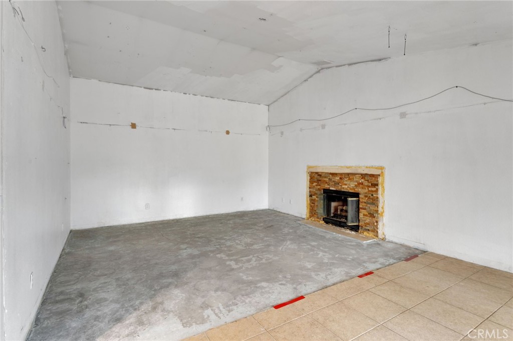 13934 Okesa Road Apple Valley, CA 92307 - Photo 12 of 34 a view of an empty room with a fireplace