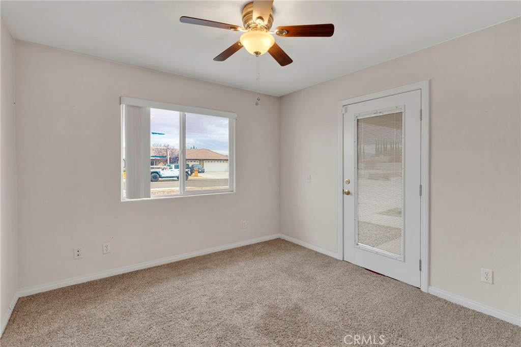 13934 Okesa Road Apple Valley, CA 92307 - Photo 17 of 34 a view of room with window and ceiling fan