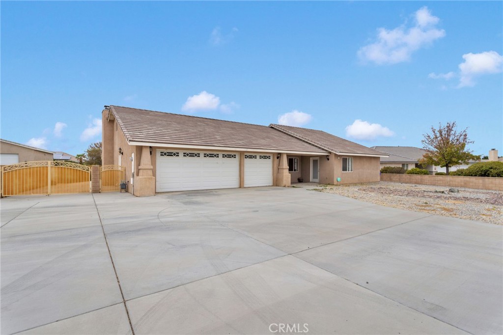 13934 Okesa Road Apple Valley, CA 92307 - Photo 2 of 34 a front view of a house with a road