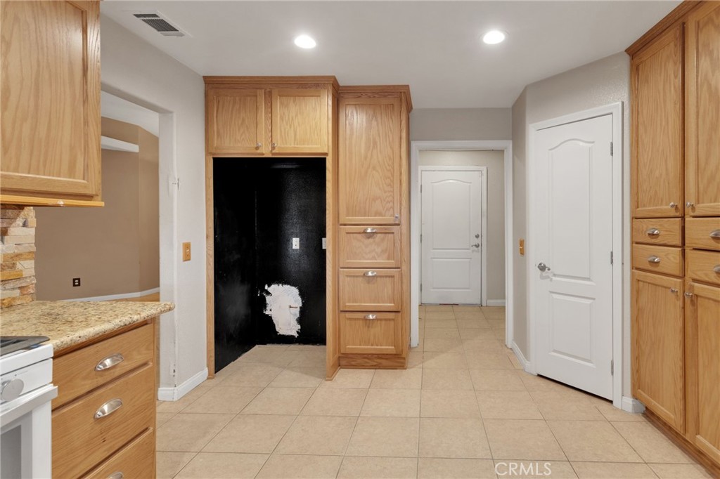 13934 Okesa Road Apple Valley, CA 92307 - Photo 10 of 34 a view of a hallway with bathroom and a bathroom
