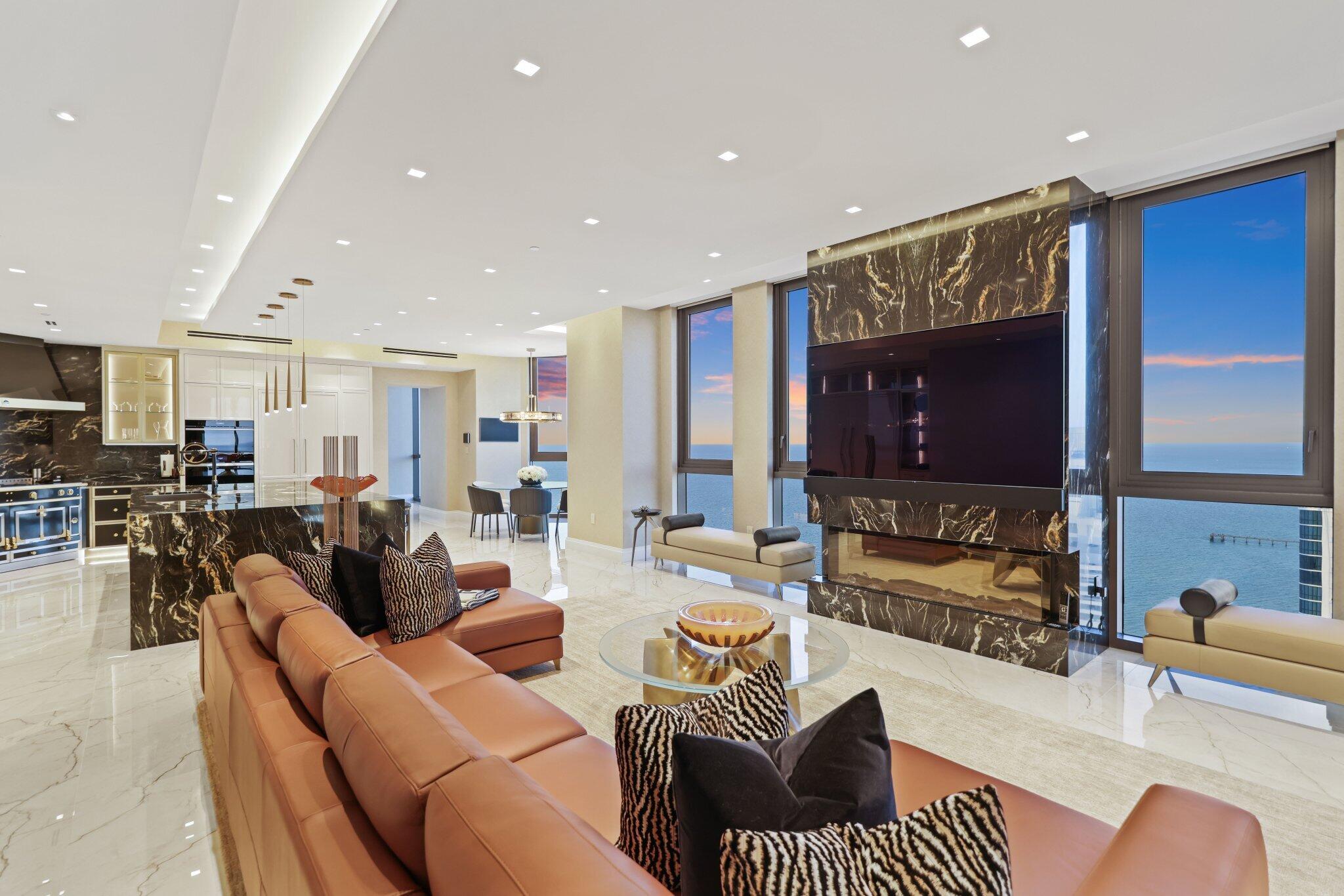 17749 Collins Avenue, Unit TS 3901/3902 Sunny Isles Beach, FL 33160 - Photo 110 of 127 a living room with furniture kitchen view and a large window