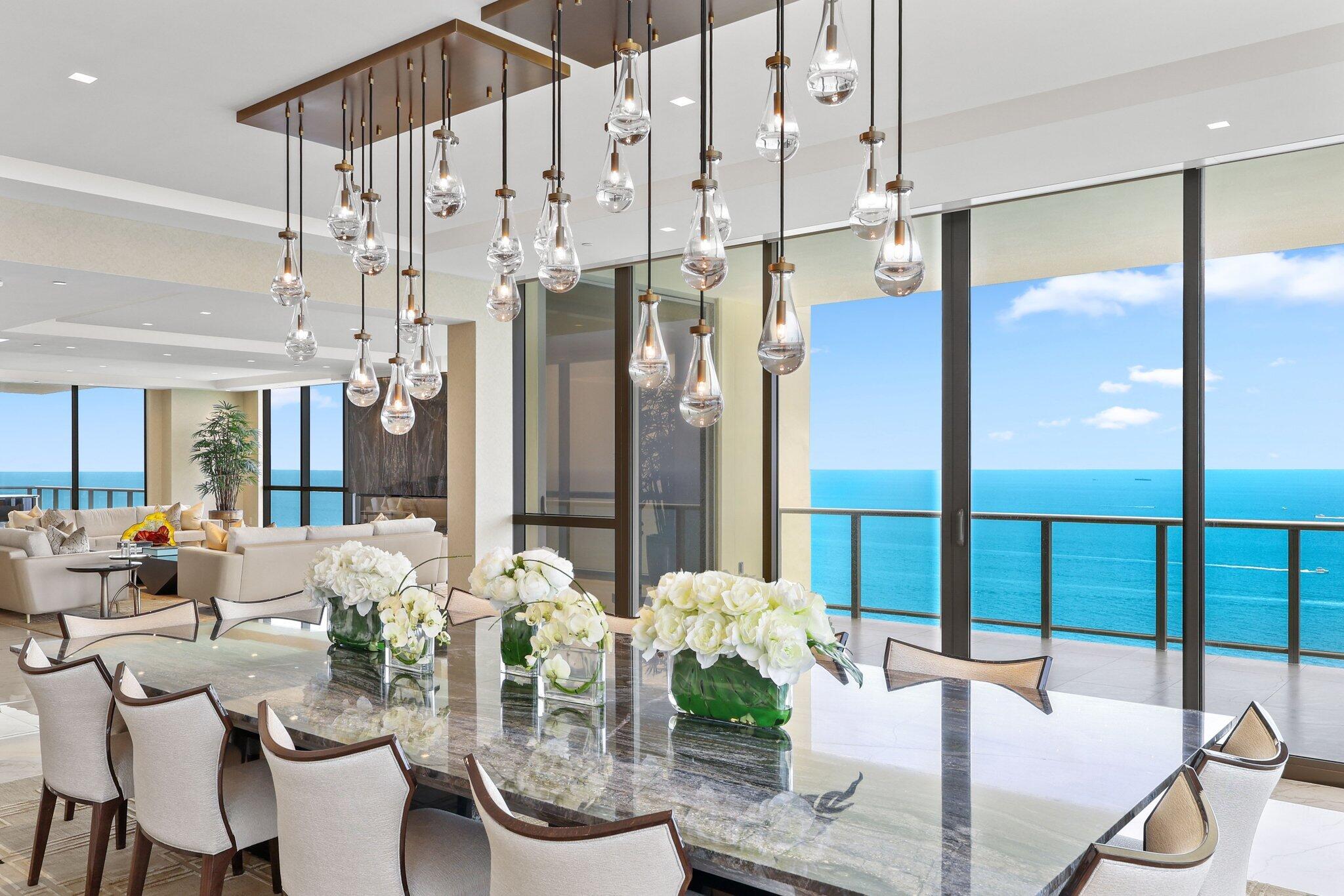 17749 Collins Avenue, Unit TS 3901/3902 Sunny Isles Beach, FL 33160 - Photo 11 of 127 a dining room with furniture a chandelier and wooden floor