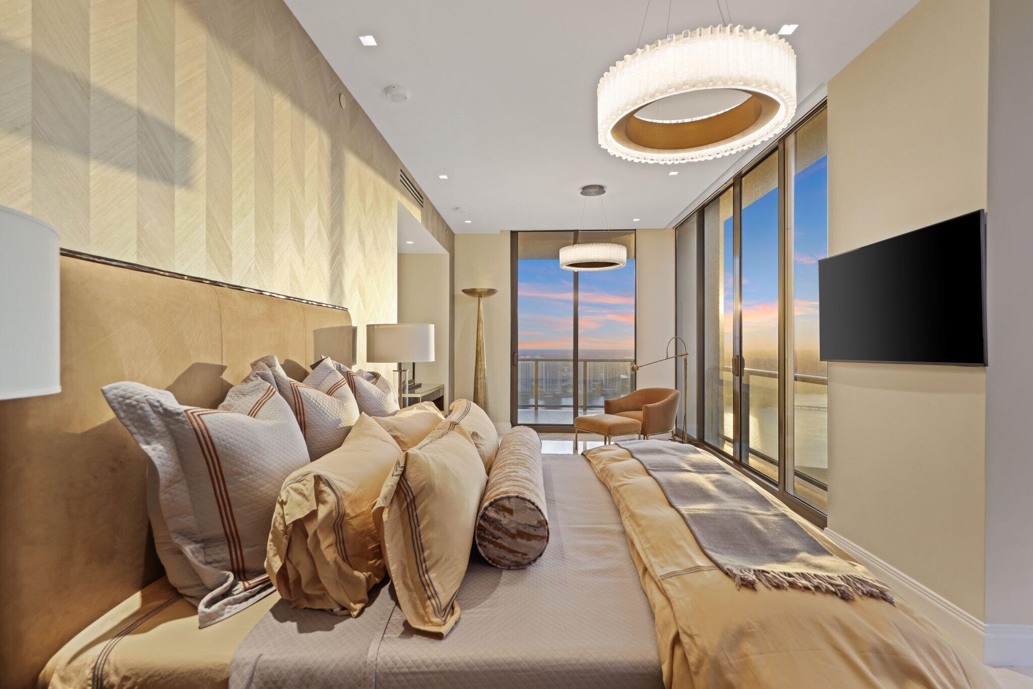 17749 Collins Avenue, Unit TS 3901/3902 Sunny Isles Beach, FL 33160 - Photo 116 of 127 a living room with furniture and a flat screen tv