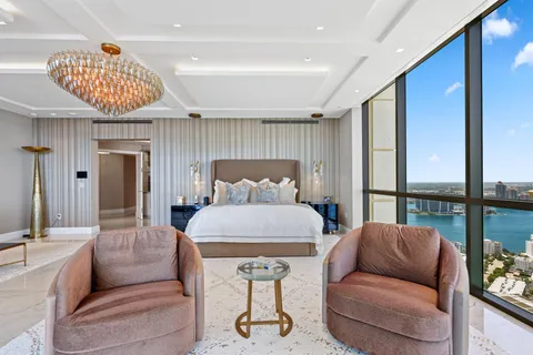 a kitchen with stainless steel appliances kitchen island granite countertop a refrigerator and microwave