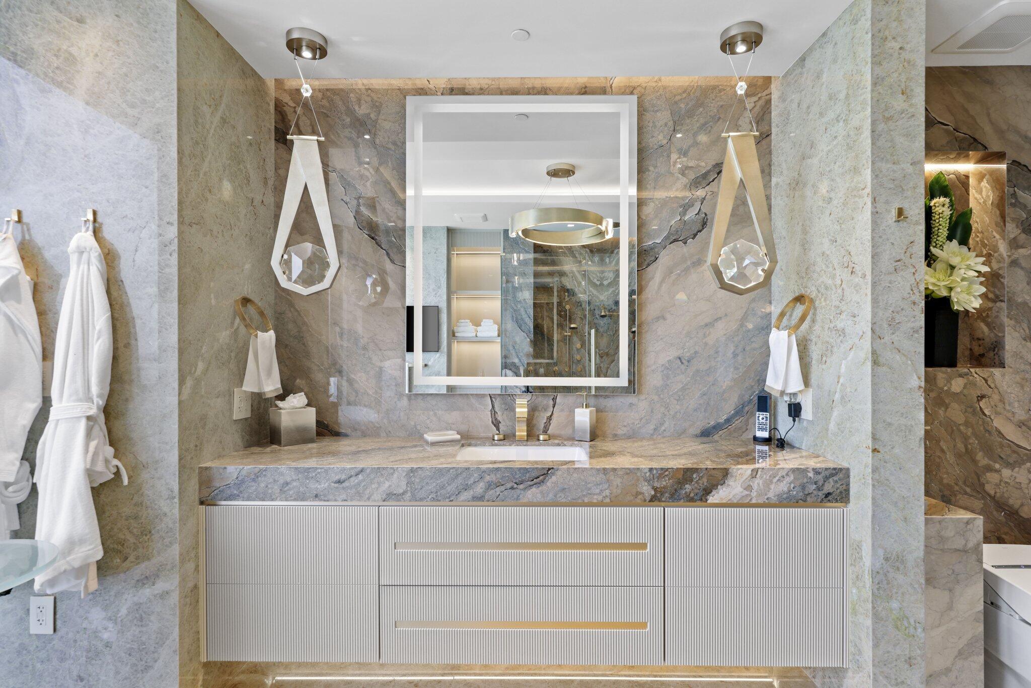 17749 Collins Avenue, Unit TS 3901/3902 Sunny Isles Beach, FL 33160 - Photo 23 of 127 a bathroom with a granite countertop sink and a mirror