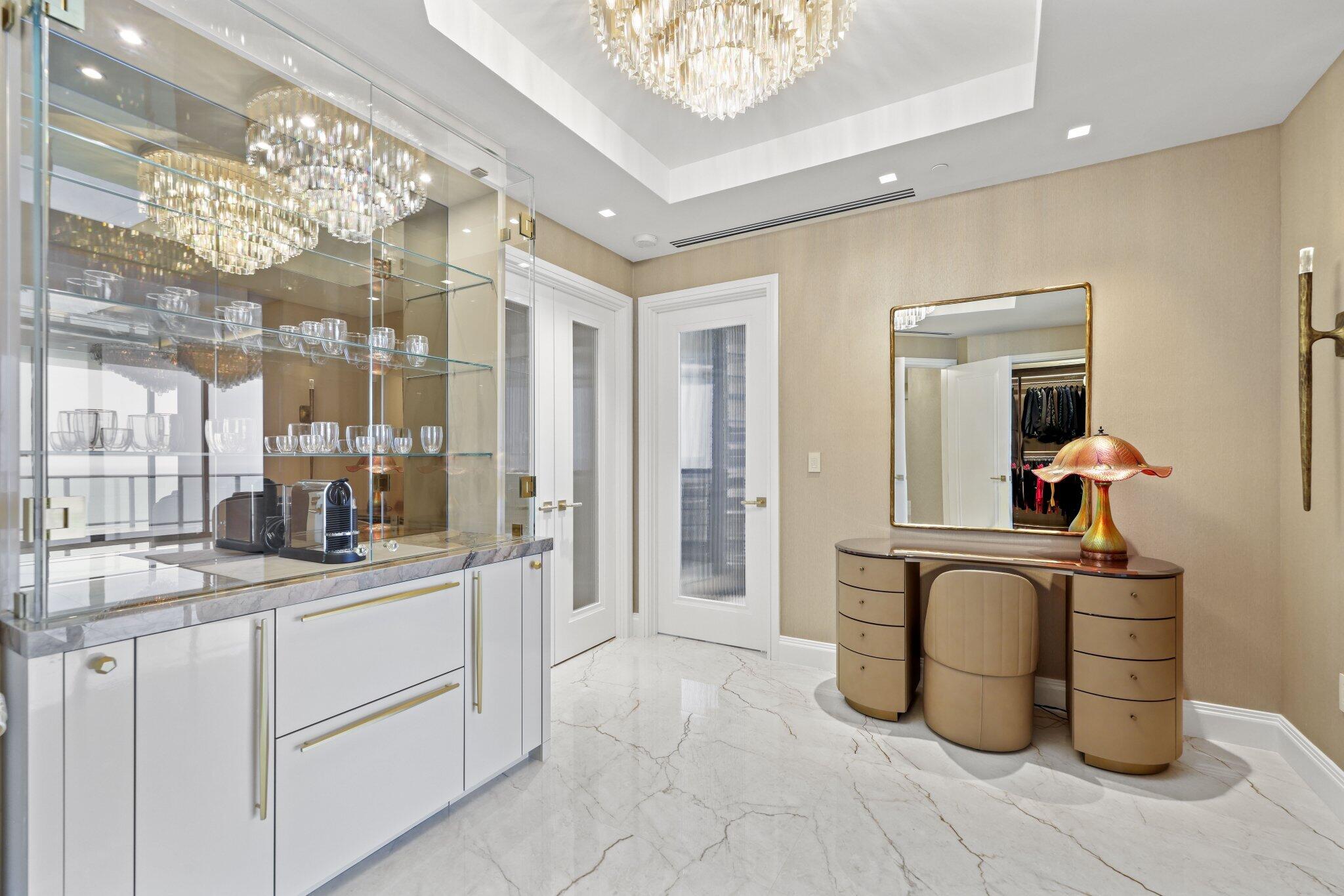 17749 Collins Avenue, Unit TS 3901/3902 Sunny Isles Beach, FL 33160 - Photo 24 of 127 a kitchen with a sink and cabinets