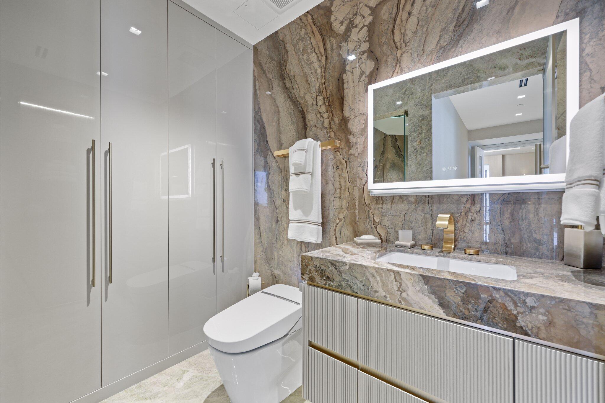 17749 Collins Avenue, Unit TS 3901/3902 Sunny Isles Beach, FL 33160 - Photo 27 of 127 a bathroom with a granite countertop sink toilet and shower