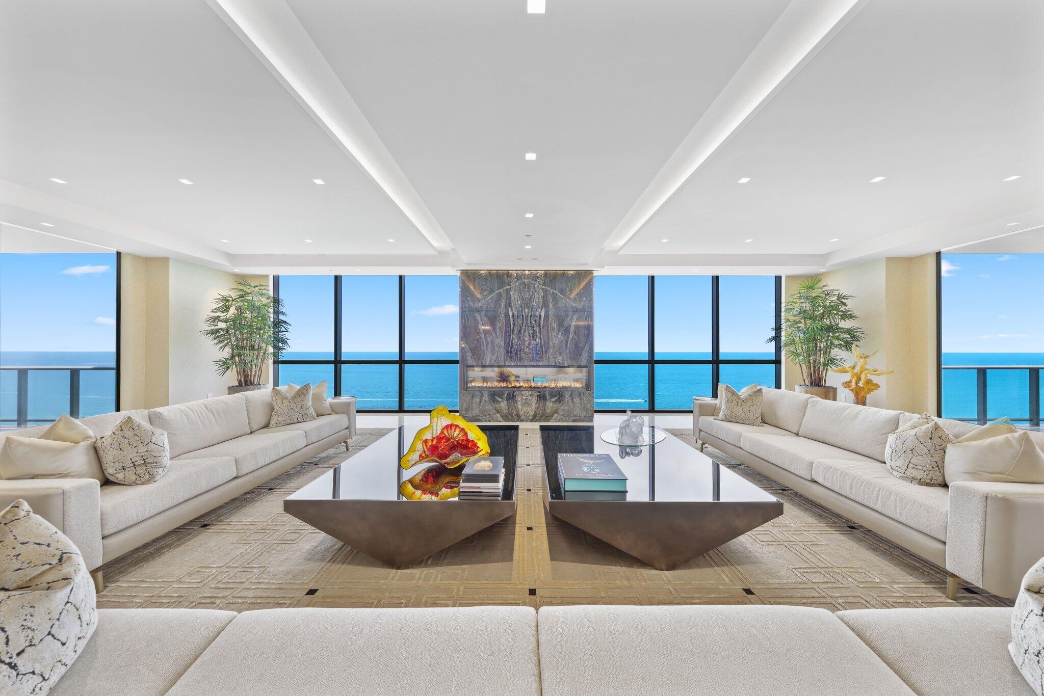 17749 Collins Avenue, Unit TS 3901/3902 Sunny Isles Beach, FL 33160 - Photo 3 of 127 a living room with furniture and a large window