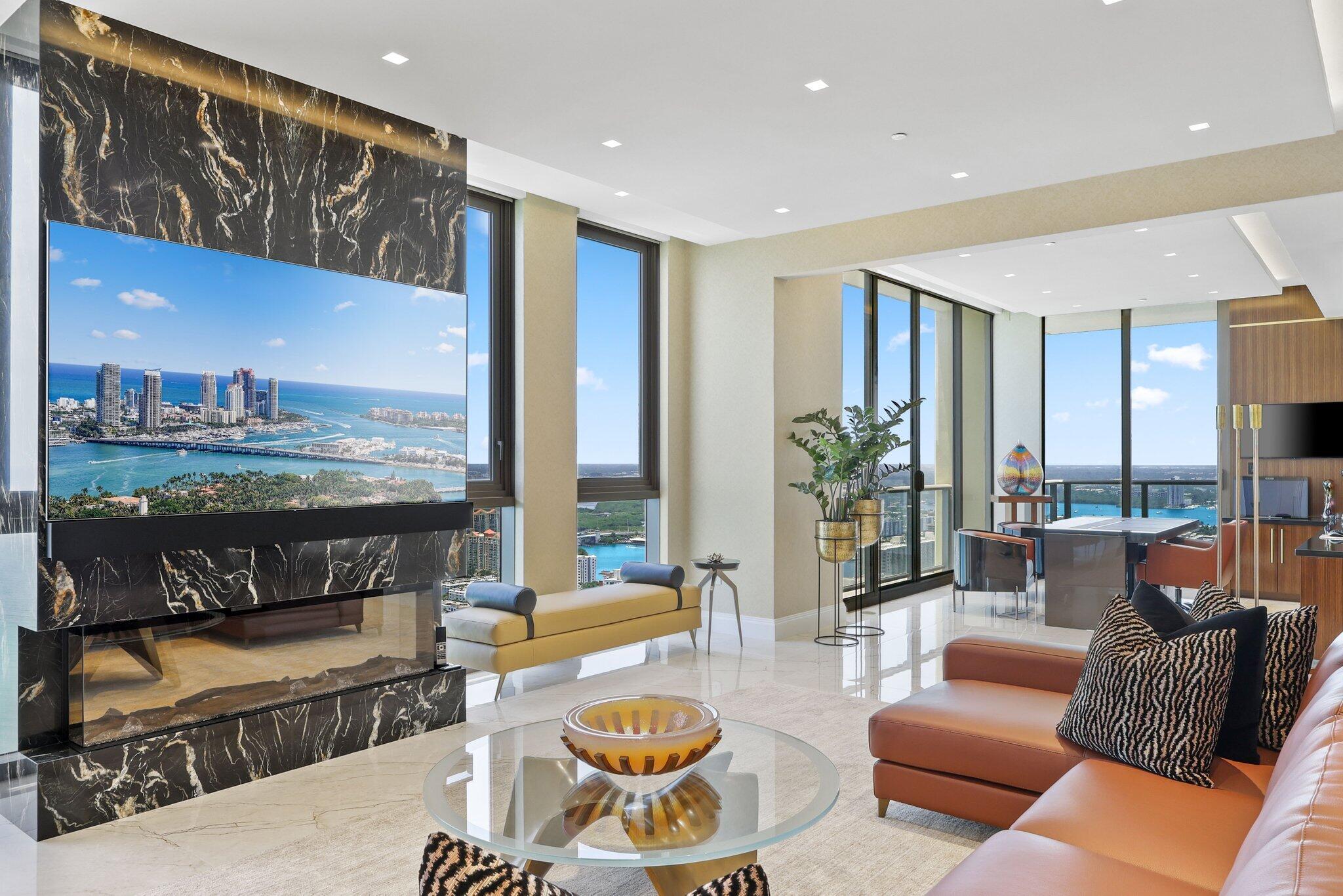 17749 Collins Avenue, Unit TS 3901/3902 Sunny Isles Beach, FL 33160 - Photo 37 of 127 a living room with furniture and a floor to ceiling window