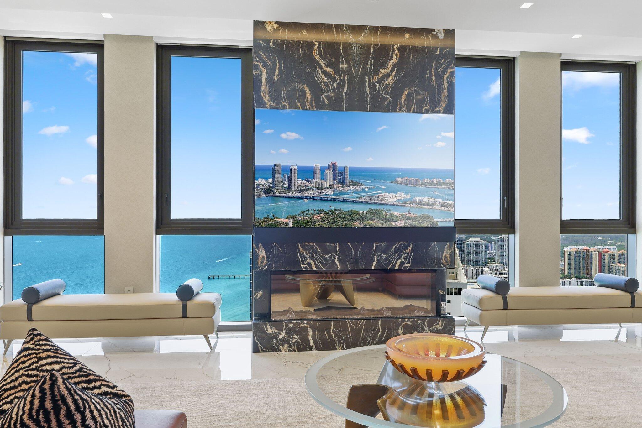 17749 Collins Avenue, Unit TS 3901/3902 Sunny Isles Beach, FL 33160 - Photo 39 of 127 a living room with furniture and a table