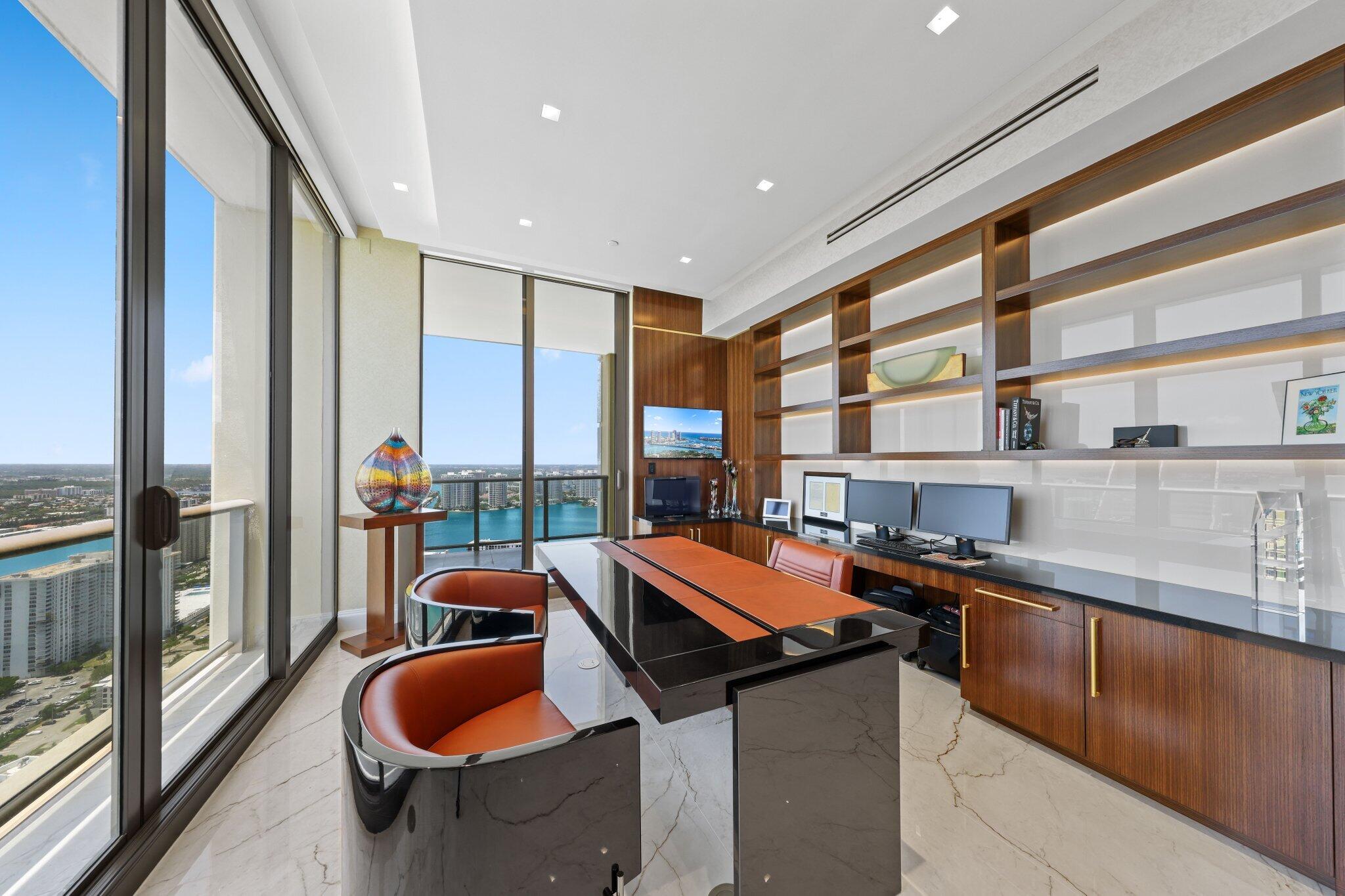 17749 Collins Avenue, Unit TS 3901/3902 Sunny Isles Beach, FL 33160 - Photo 40 of 127 a kitchen with stainless steel appliances granite countertop sink stove and glass door