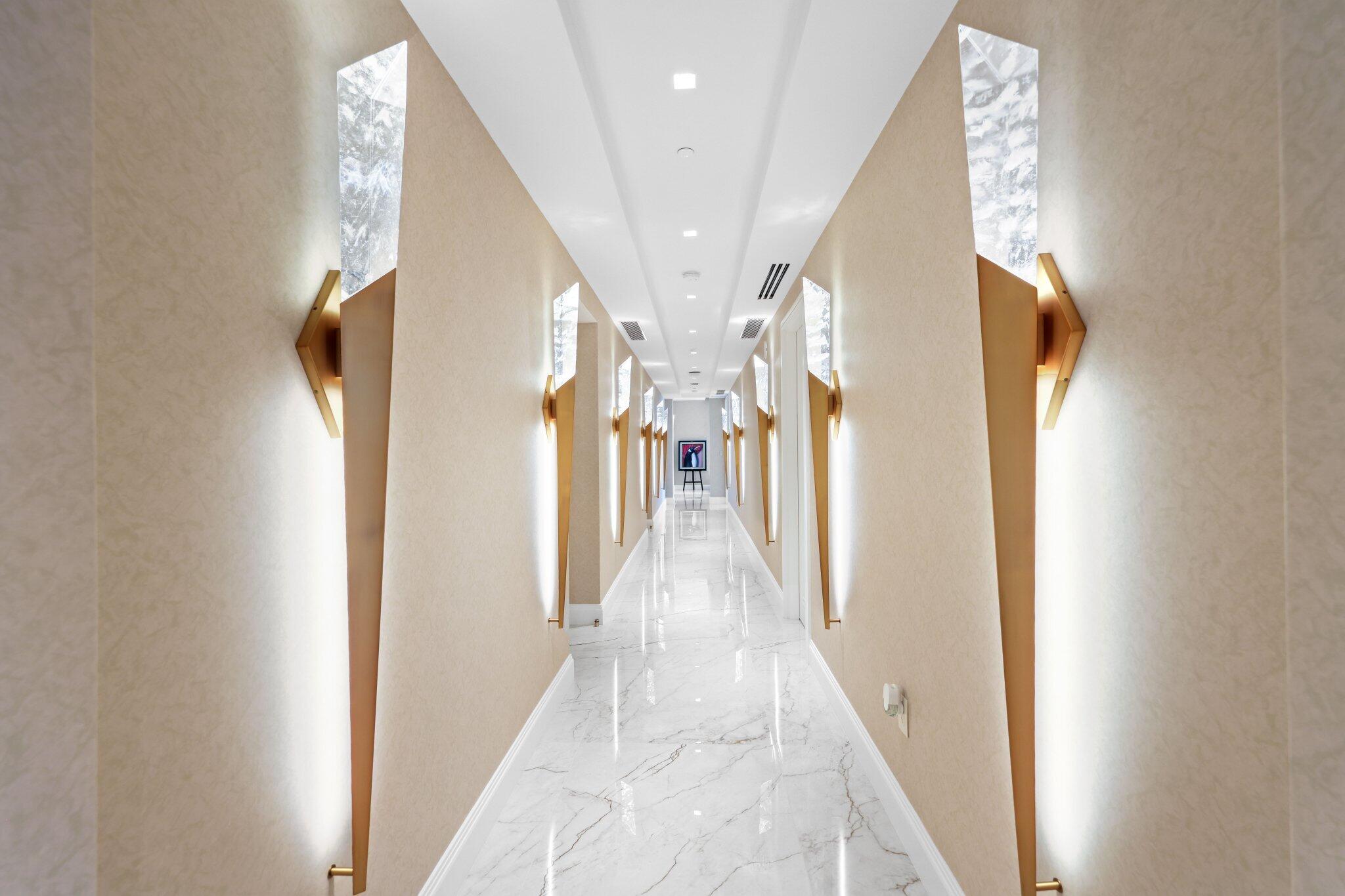 17749 Collins Avenue, Unit TS 3901/3902 Sunny Isles Beach, FL 33160 - Photo 43 of 127 a view of a hallway with wooden floor and staircase