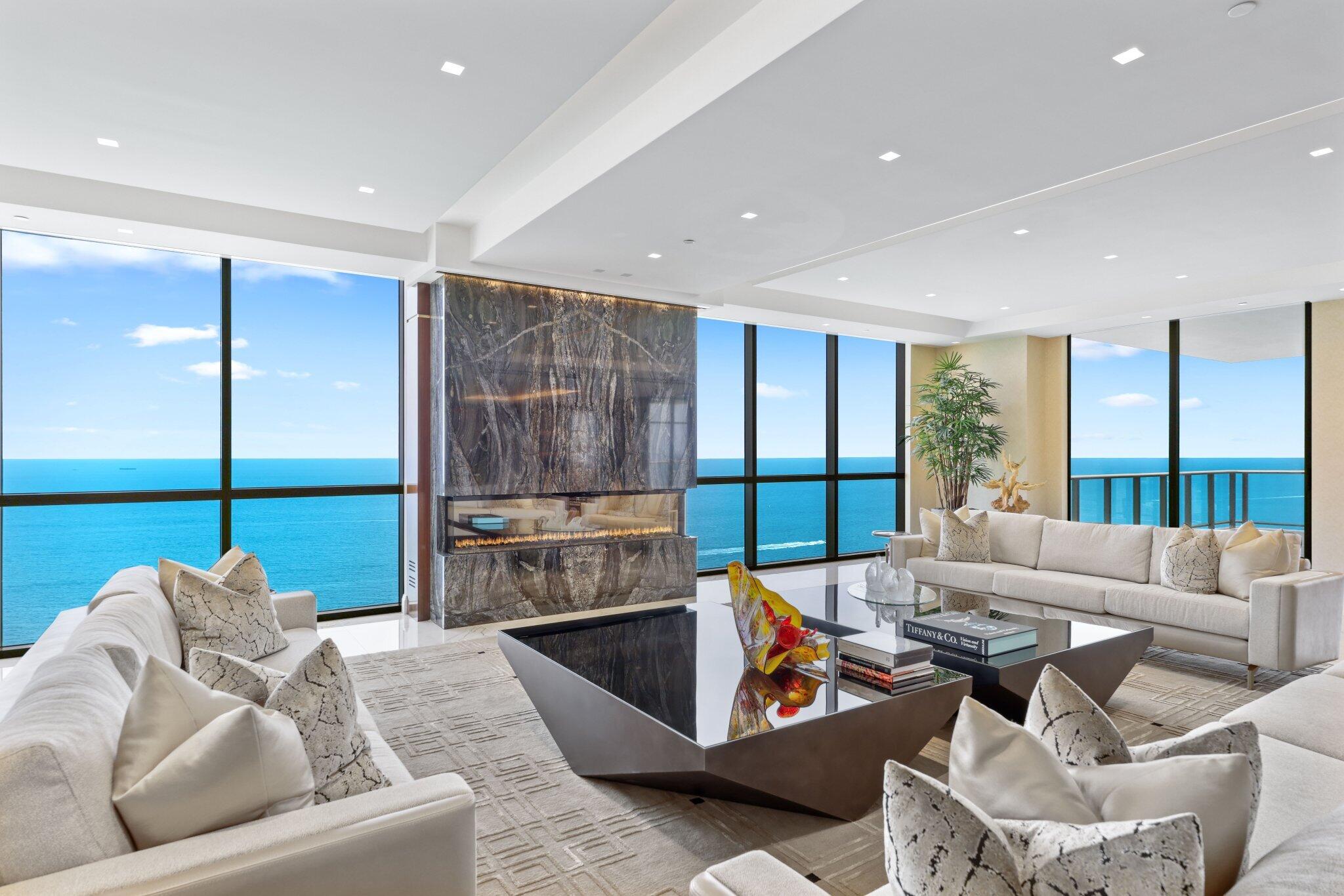 17749 Collins Avenue, Unit TS 3901/3902 Sunny Isles Beach, FL 33160 - Photo 5 of 127 a living room with furniture and a large window