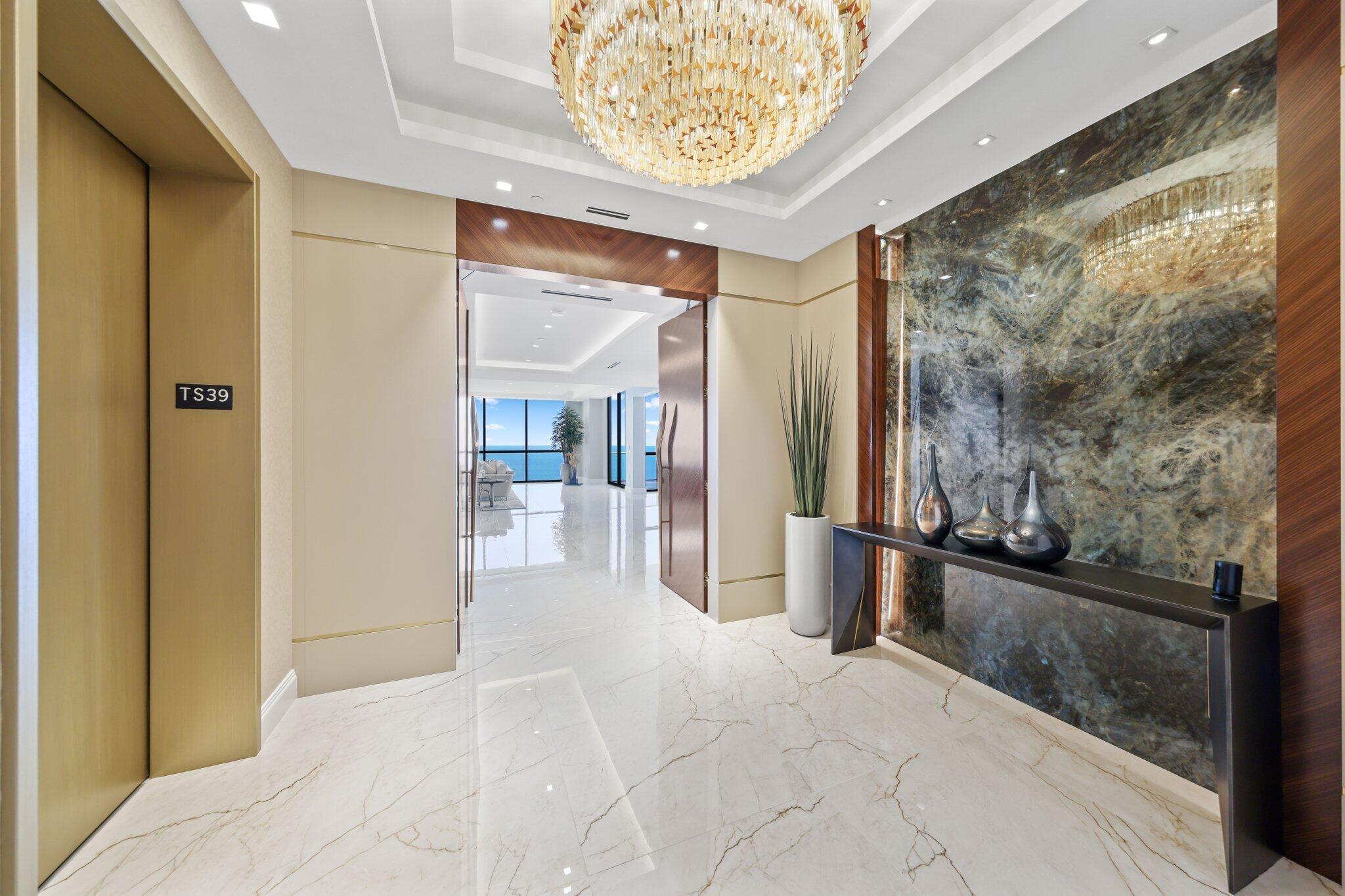 17749 Collins Avenue, Unit TS 3901/3902 Sunny Isles Beach, FL 33160 - Photo 71 of 127 a view of a hallway with wooden floor and furniture