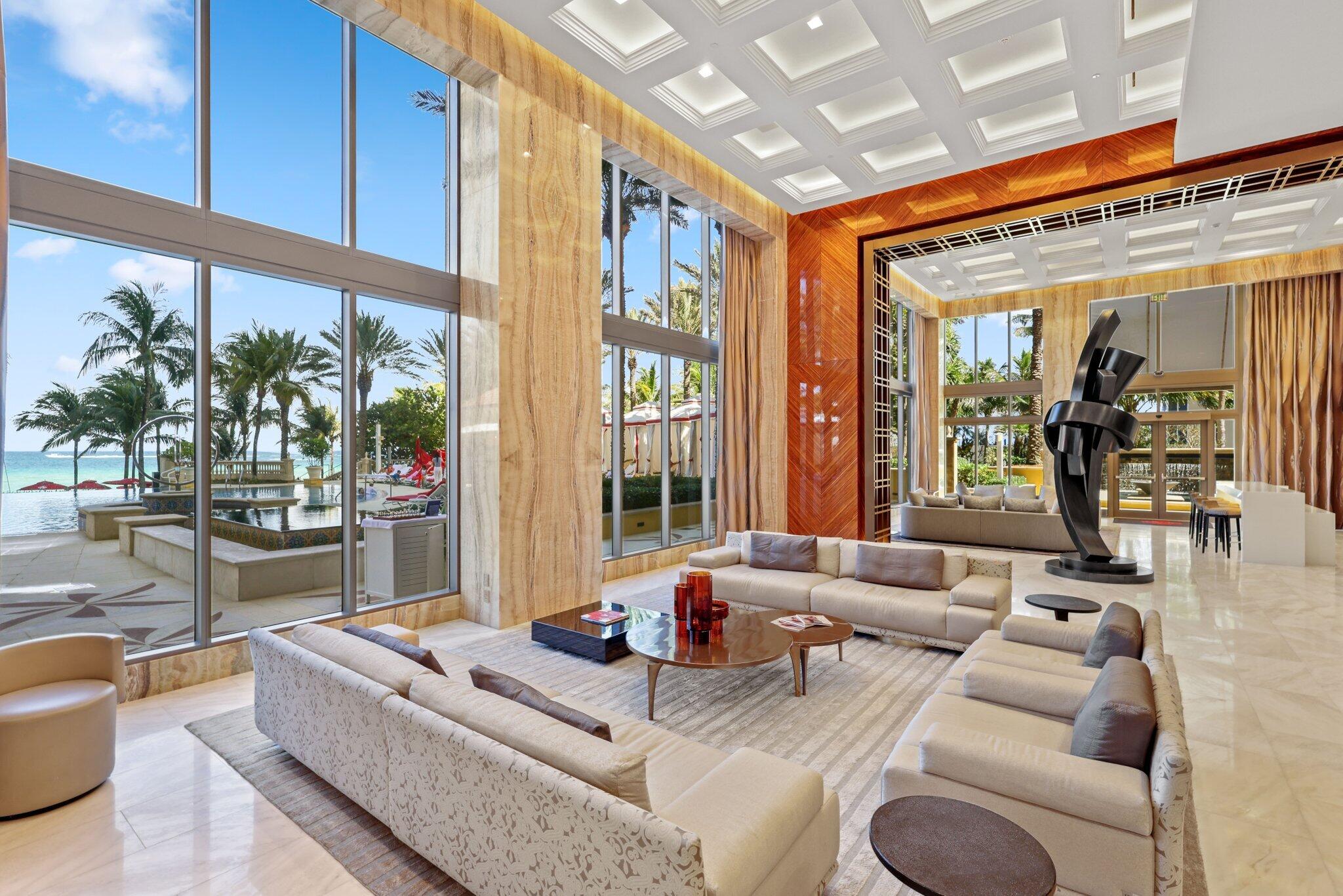 17749 Collins Avenue, Unit TS 3901/3902 Sunny Isles Beach, FL 33160 - Photo 91 of 127 a living room with furniture and a large window