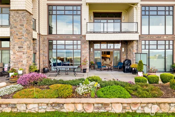 a front view of a house with outdoor seating