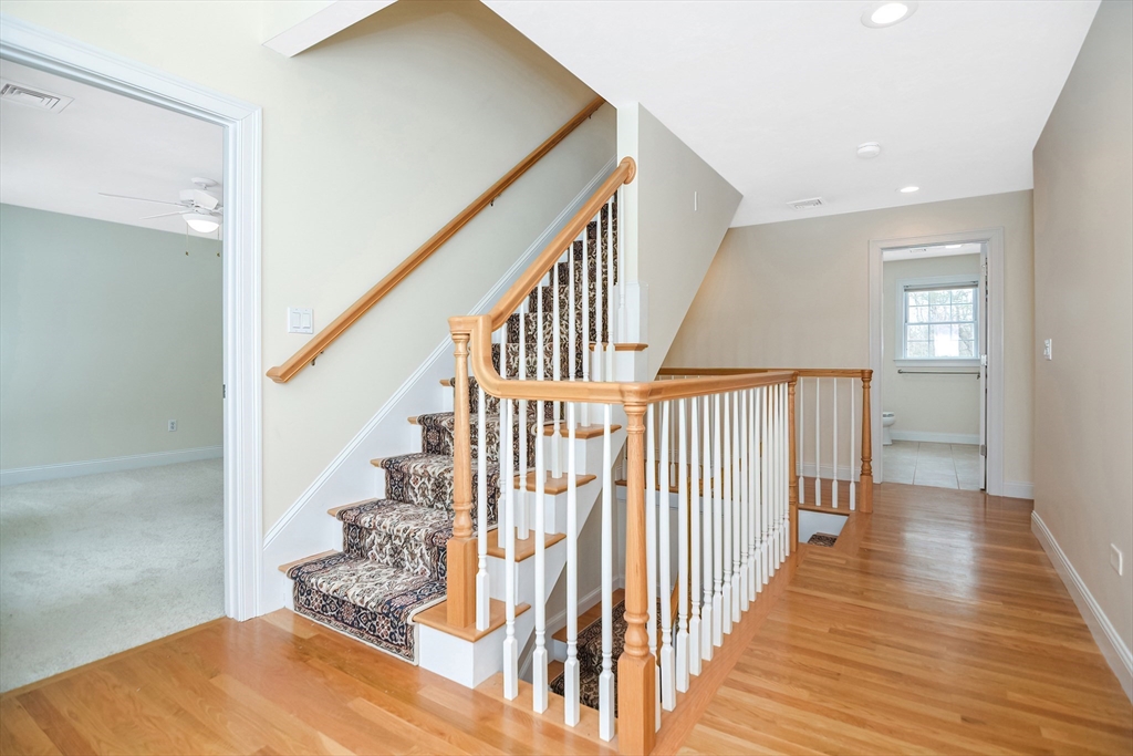 268 Hall Street Dunstable, MA 01827 - Photo 24 of 36 a view of a hallway with wooden floor and staircase