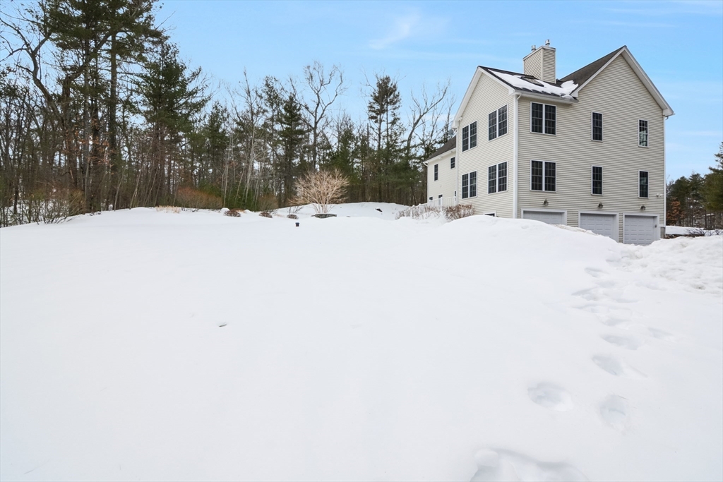 268 Hall Street Dunstable, MA 01827 - Photo 33 of 36 a view of white house with a snow in the yard