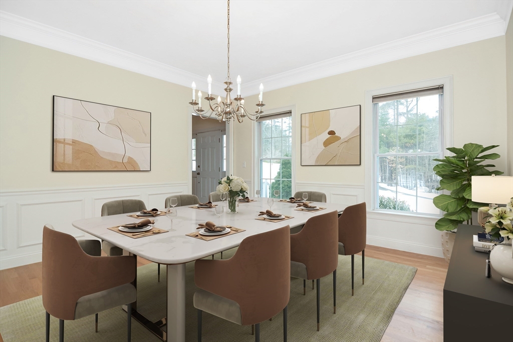 268 Hall Street Dunstable, MA 01827 - Photo 5 of 36 a dining room with wooden floor a chandelier a wooden table and chairs