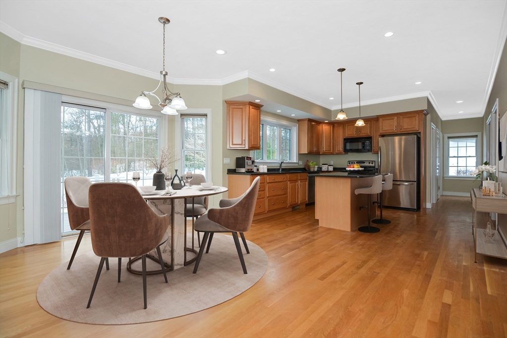 268 Hall Street Dunstable, MA 01827 - Photo 6 of 36 a dining room with furniture a chandelier and wooden floor