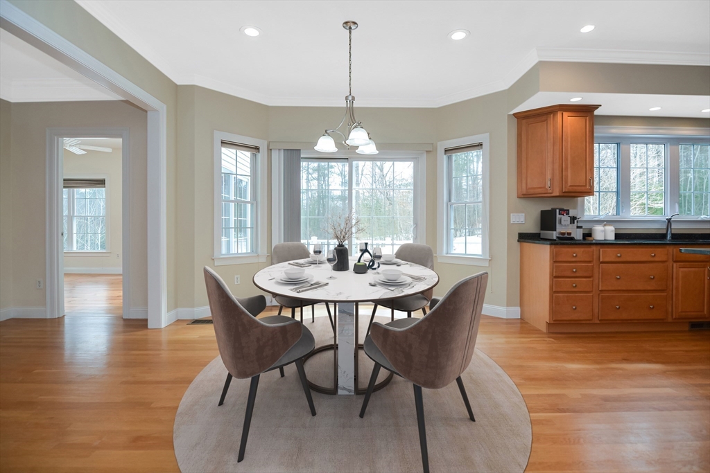 268 Hall Street Dunstable, MA 01827 - Photo 7 of 36 a dining room with furniture a chandelier and wooden floor