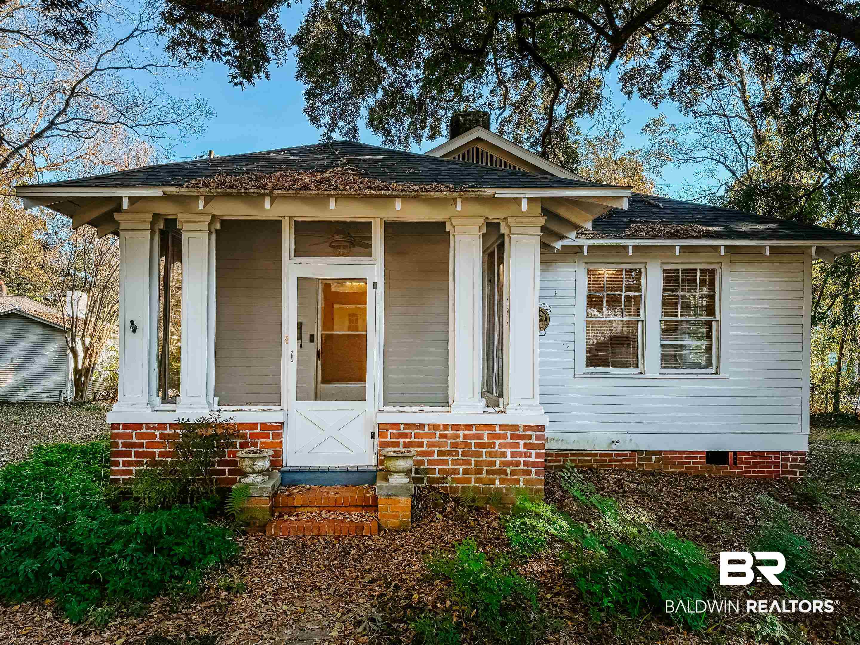 206 1st Street Mobile, AL 36611 - Photo 2 of 26 View of front of house featuring a porch, crawl space, and roof with shingles